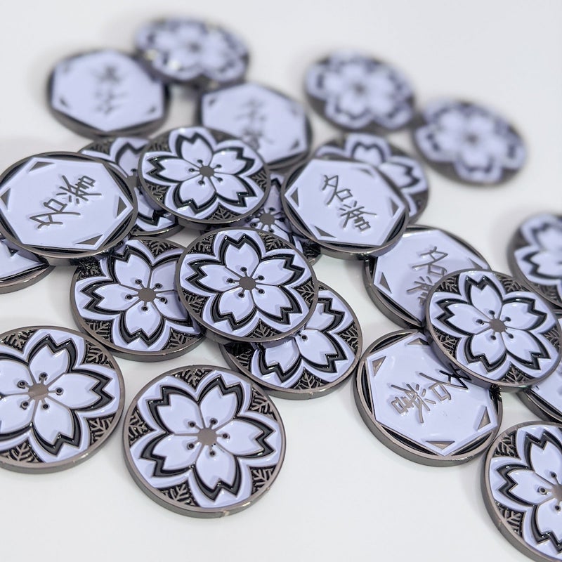 a bunch of tokens, showing the fate side and the honour side of Luxury Playstyle's Yozakura Mangetsu sakura tokens. 